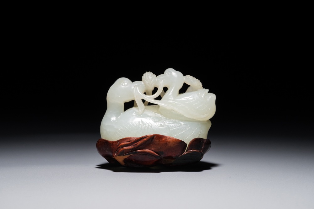 A Chinese jade group of two Mandarin ducks on lotus leaf, 19th C.